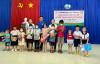 Bí thư xã Đoàn Long Thành Nam trao tặng các phần quà cho trẻ em có hoàn cảnh đặc biệt khó khăn